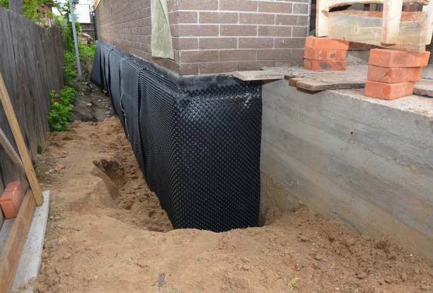 Happy homeowners after waterproofing job in Ronkonkoma